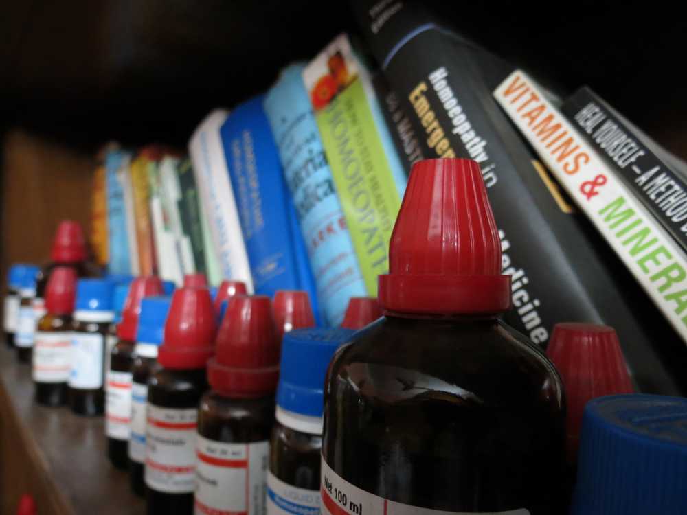 Homeopathic medicine bottles and pharmacy shelves